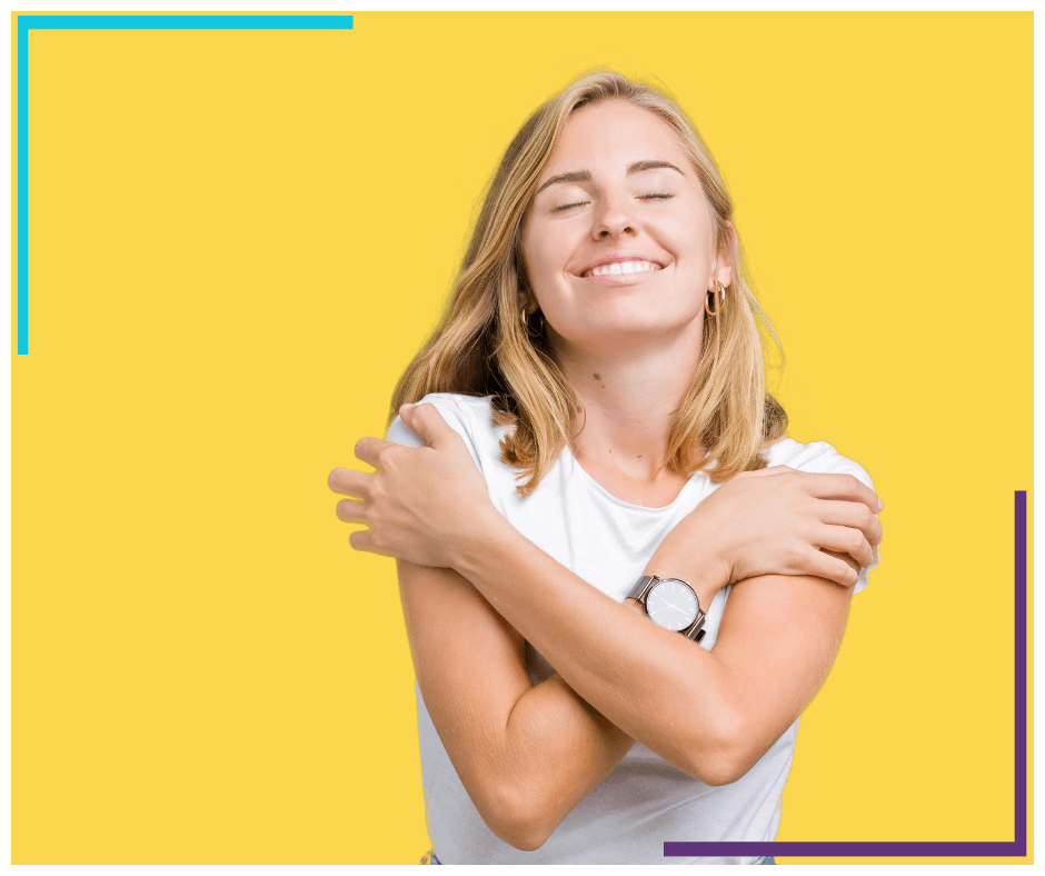 Woman wearing casual white t-shirt over isolated yellow background hugging herself